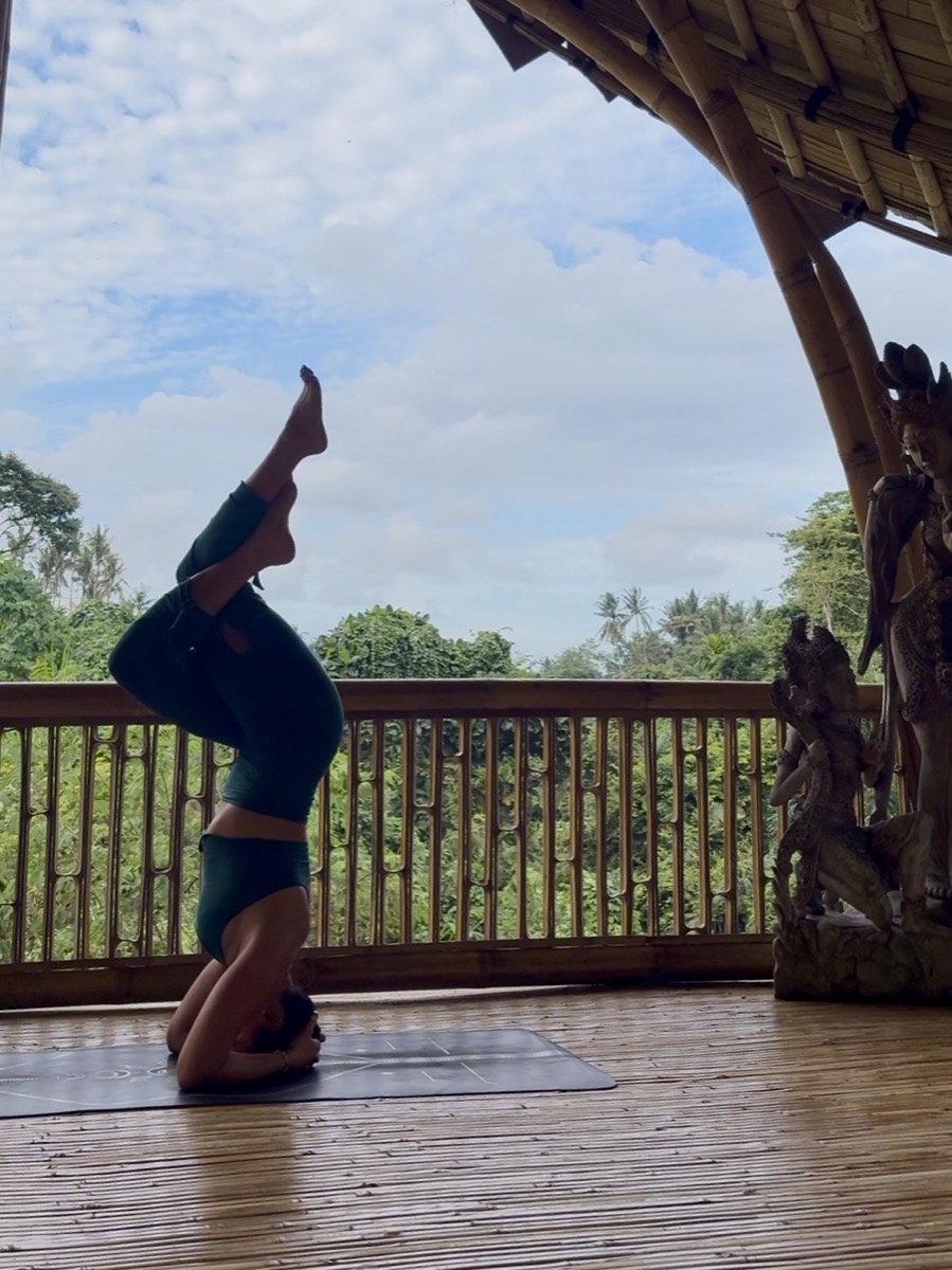 Jessica Szabo in a supported headstand